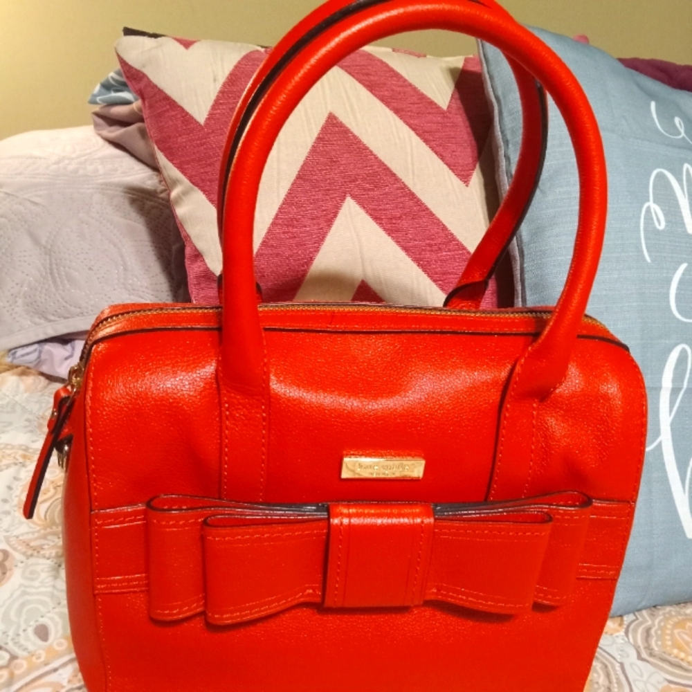 Kate Spade genuine leather red bow satchel purse.